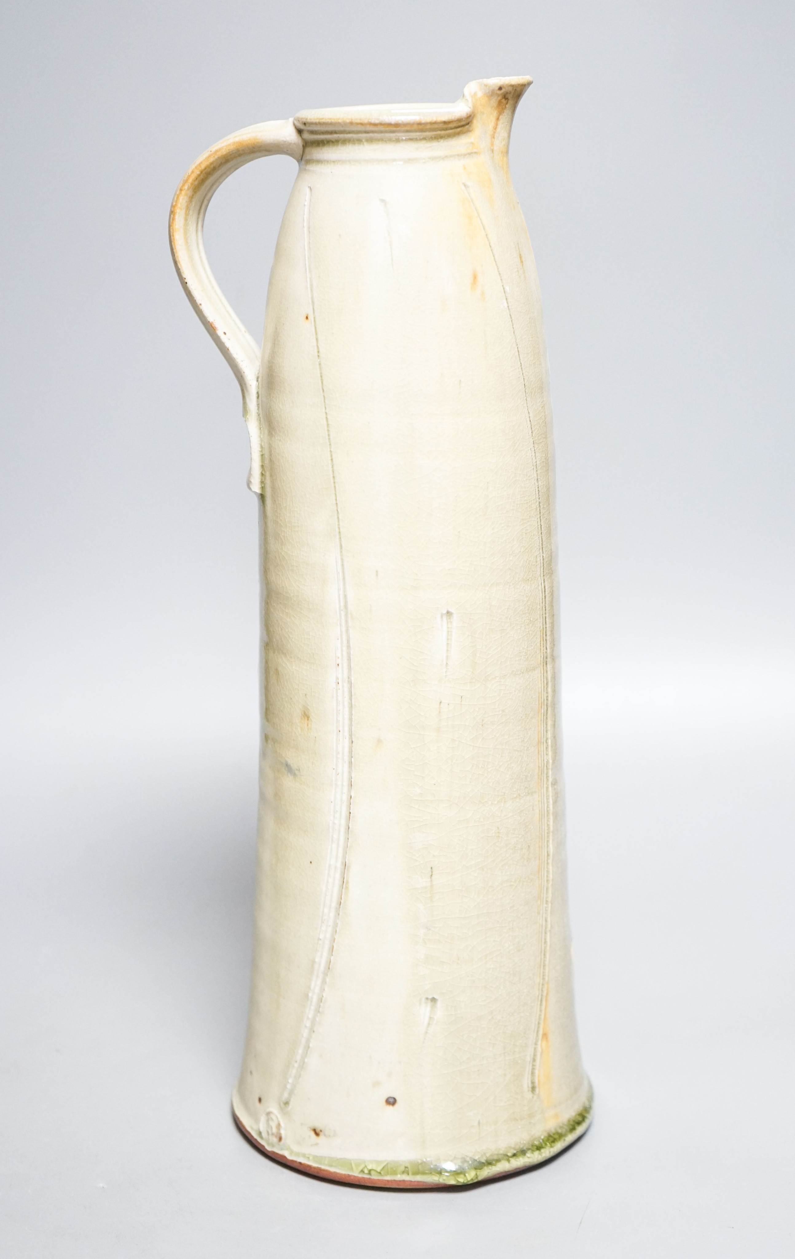 Stephen Parry (b.1950), a tall pale celadon glazed jug 39cm